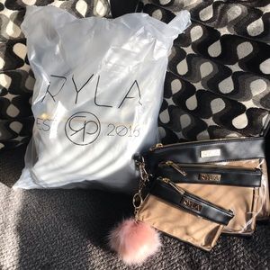 BNIB Ryla Pack Diaper Bag with Pouches and Pom
